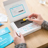 Person opening test kit
