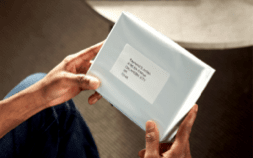 Person holding box in discreet packaging